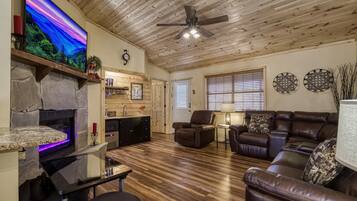 Flat-screen TV, fireplace, video game console, table football