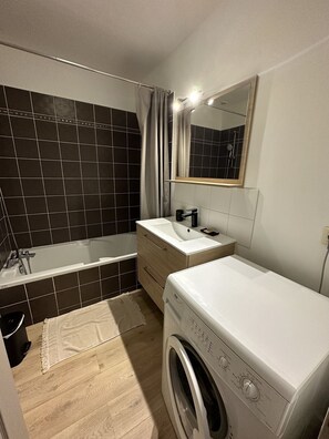 Bathtub, hair dryer, towels