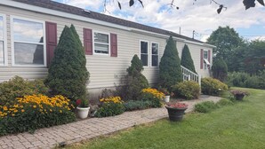 A single-story house with a brick pathway leading to the front door. - Grandview Private 2 room suite, 5 minutes to Dreams Park, close to town (Milford)