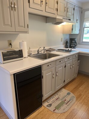 Fridge, microwave, stovetop, coffee/tea maker