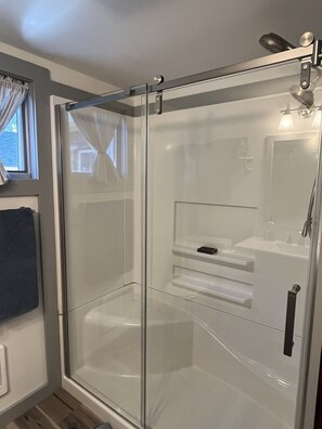 Recently renovated bathroom with shower