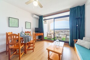 TV - Apartment "Residencial Fénix" with Shared Pool, Terrace & Wi-Fi (Roquetas de Mar)