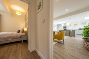 A modern apartment with a bedroom, a dining area, and a kitchen. - Little Soames, Holt, Norfolk (Holt)