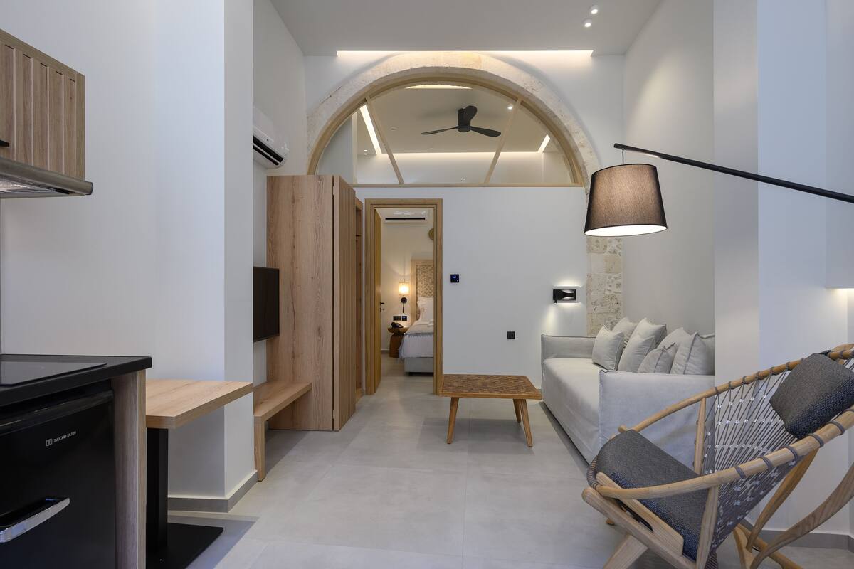A modern interior with a kitchen, dining area, and living space.