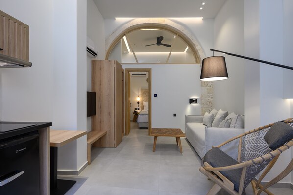 A modern interior with a kitchen, dining area, and living space.