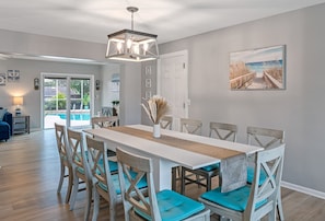 Expansive, beach-themed dining room designed to accommodate 10 guests. - Luxury Oasis🌴☀️• Heated Saltwater Pool • Near Beaches • Family-Friendly (Clearwater)