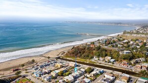 An aerial view of a coastal town with a beach, a river, and a bridge. - Sunny Rio Del Mar Beach Townhome – Relax, Unwind & Enjoy the Coast (Aptos)