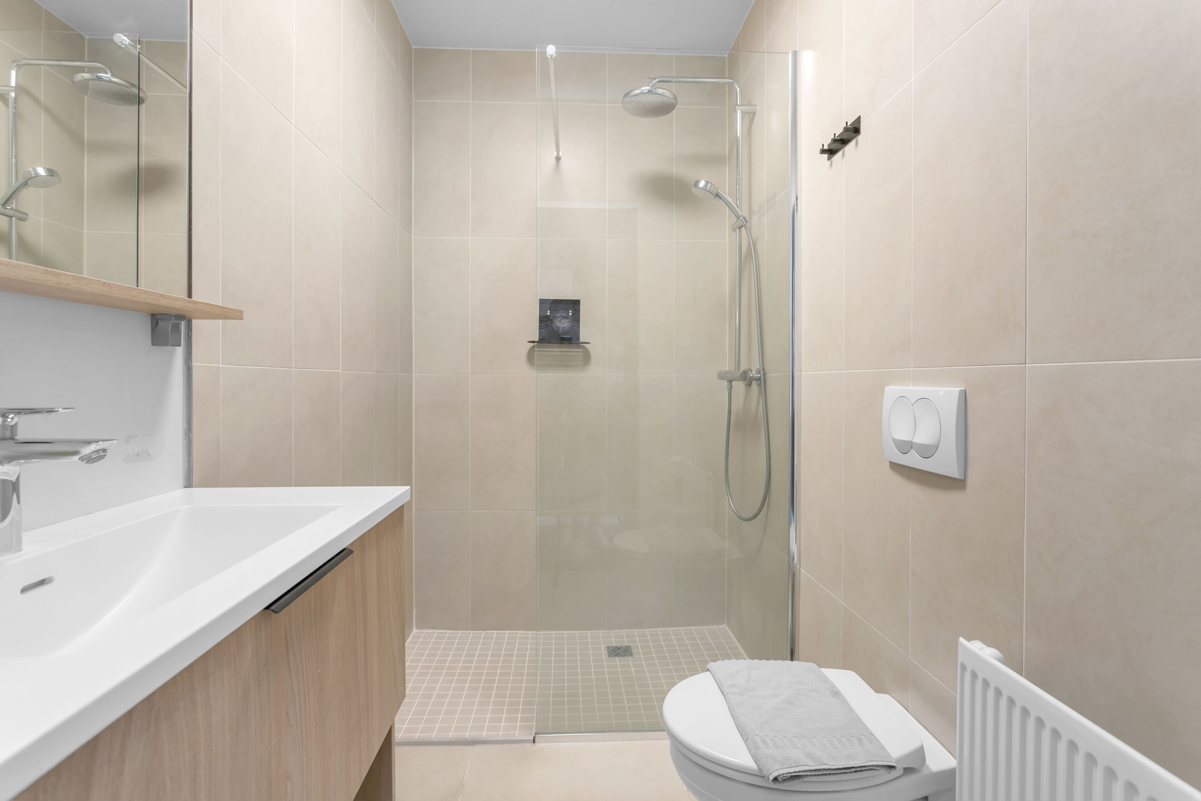 deluxe studio | bathroom | shower, hair dryer, towels
