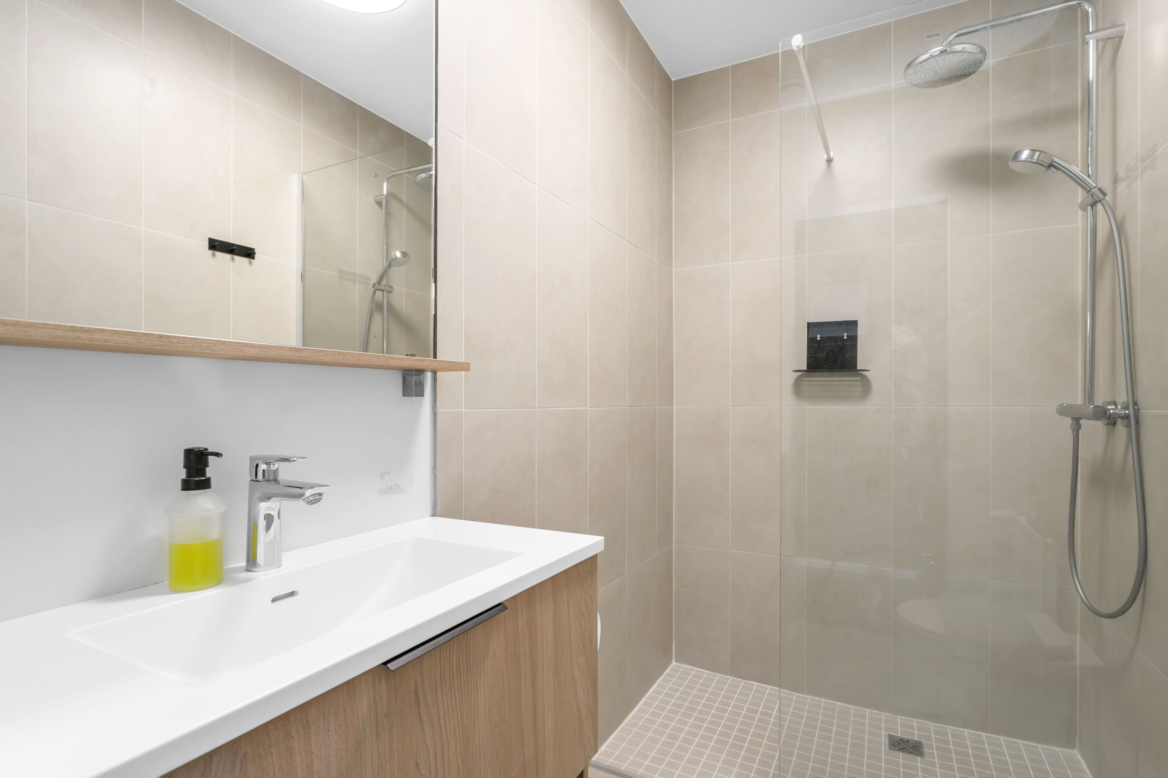 deluxe studio | bathroom | shower, hair dryer, towels