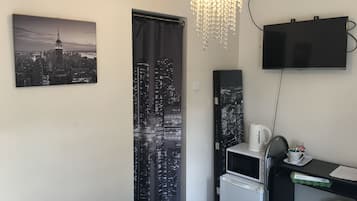 Hypo-allergenic bedding, blackout drapes, iron/ironing board, free WiFi