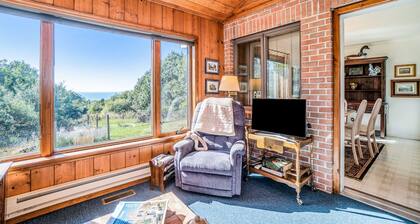 Dog-friendly, lake view home with three season room, fireplace, video projector