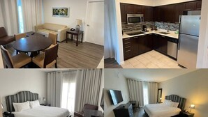 A hotel room with a bed, bedside table, and a TV. The room has a wooden floor and a window with curtains. - Pet friendly hotel aprt on Celebration Pl. 2bdr (Celebration)