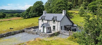 An impressive, detached stone-built cottage set within Gwydir Forest.