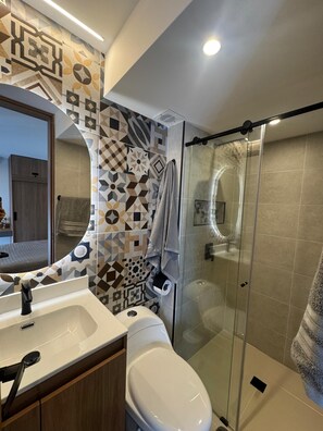 Shower, hair dryer, towels, soap