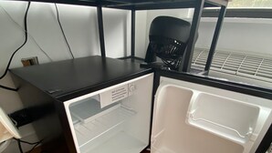 A compact kitchenette with a refrigerator, a microwave, and a sink. - room in brooklyn (Brooklyn)