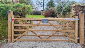 A wooden gate with a sign reading "3 Howick Cottage." - 2 bedroom accommodation in Hesket Newmarket, near Wigton (Hesket Newmarket, near Wigton)