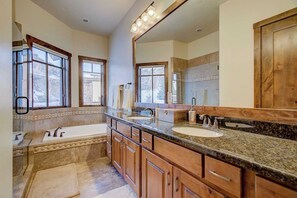 A spacious bathroom with a large vanity, double sinks, and a walk-in shower. - Fairway Ski and Golf Retreat by Avantstay Blocks From the Ski Lift! Beautiful Views w/ Hot Tub (Park City)