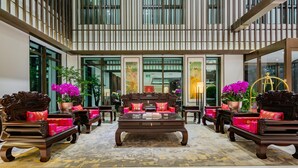 A lobby with traditional furniture, a central coffee table, and large windows. - Grand Madison Hongjian Zhongchuan Airport (Lanzhou)