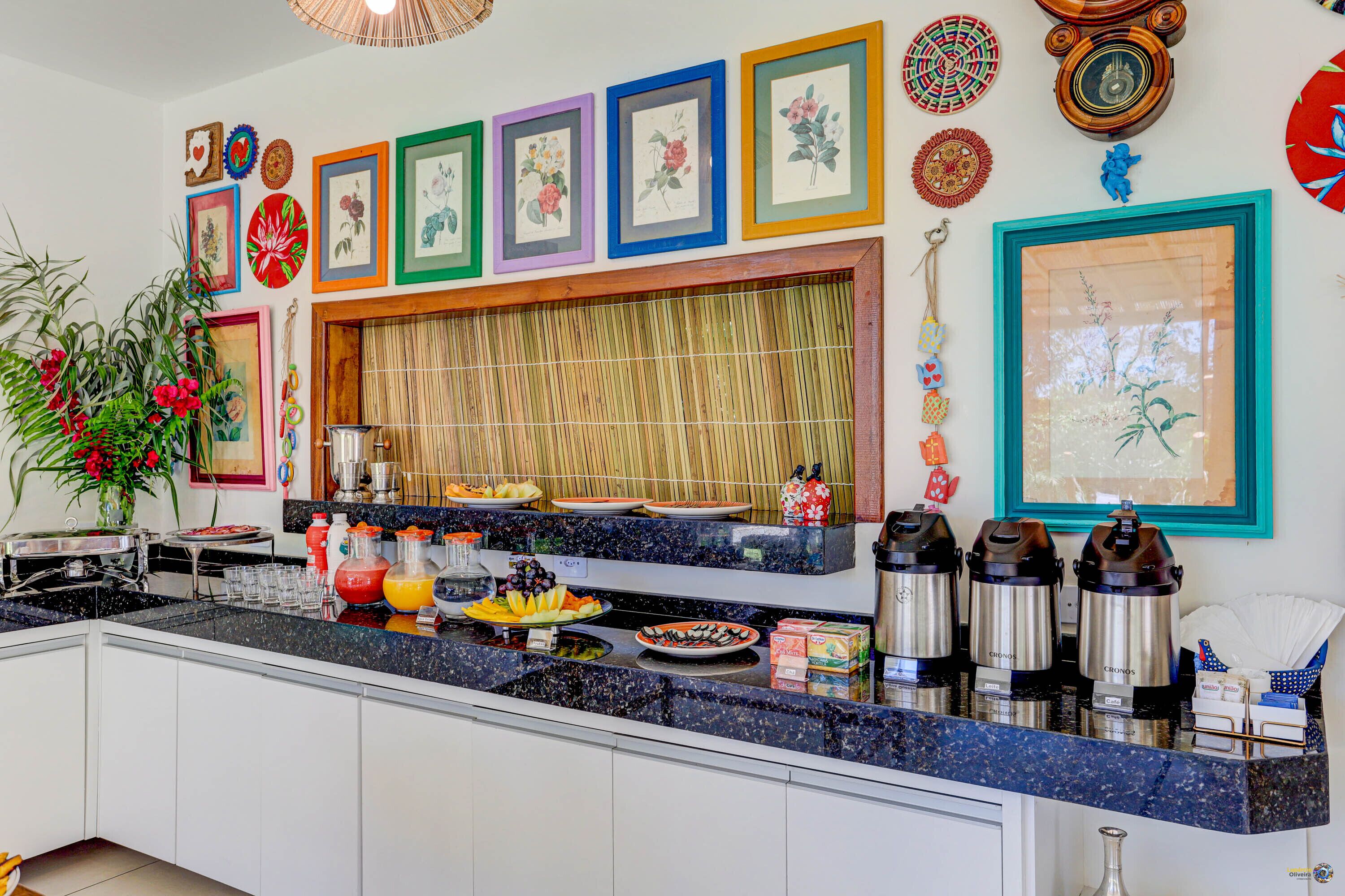 A kitchen with a buffet setup, including a variety of food items and a coffee station.