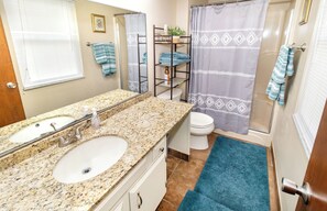 Combined shower/tub, hair dryer, towels, soap