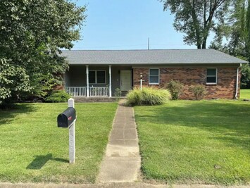 Summer time view of front of house.
