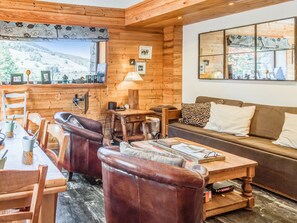 TV, fireplace, books - Appartement Stenoga - Welkeys (Megève)