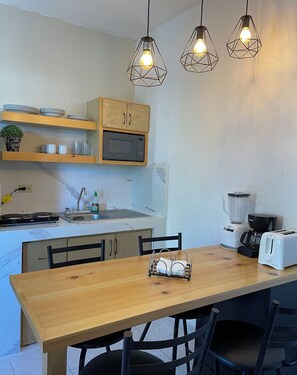 Enjoy cooking in this well-equipped kitchen with a microwave, coffee maker, and ample counter space.