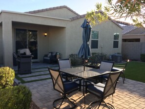 An outdoor patio with a table and chairs, a covered umbrella, and a grill. - in Glendale Near stadium, entertainment & shopping (Glendale)