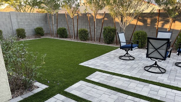 A patio with a small lawn, stone tiles, and outdoor furniture. - in Glendale Near stadium, entertainment & shopping (Glendale)