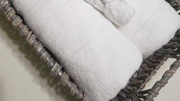 Combined shower/bathtub, hair dryer, towels, soap