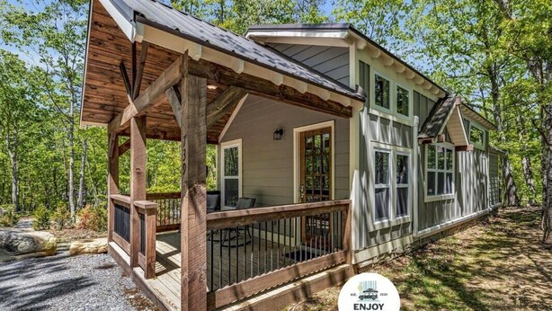 A cabin with a porch, large windows, and a deck. - Menlo GA Tiny Home Experience! Beautiful Drive (Menlo)