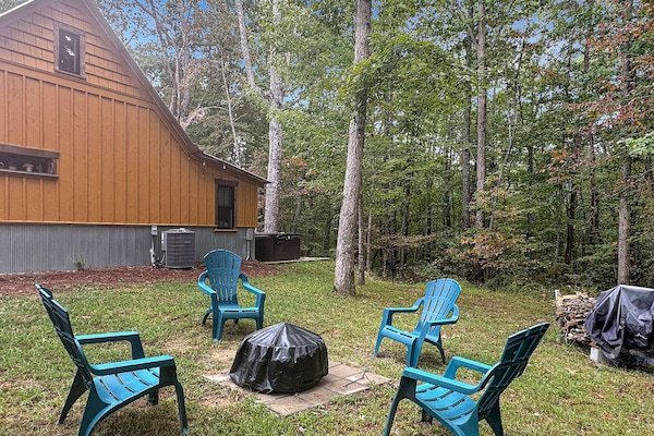 Private view of woods while enjoying firepit, grill and hot tub