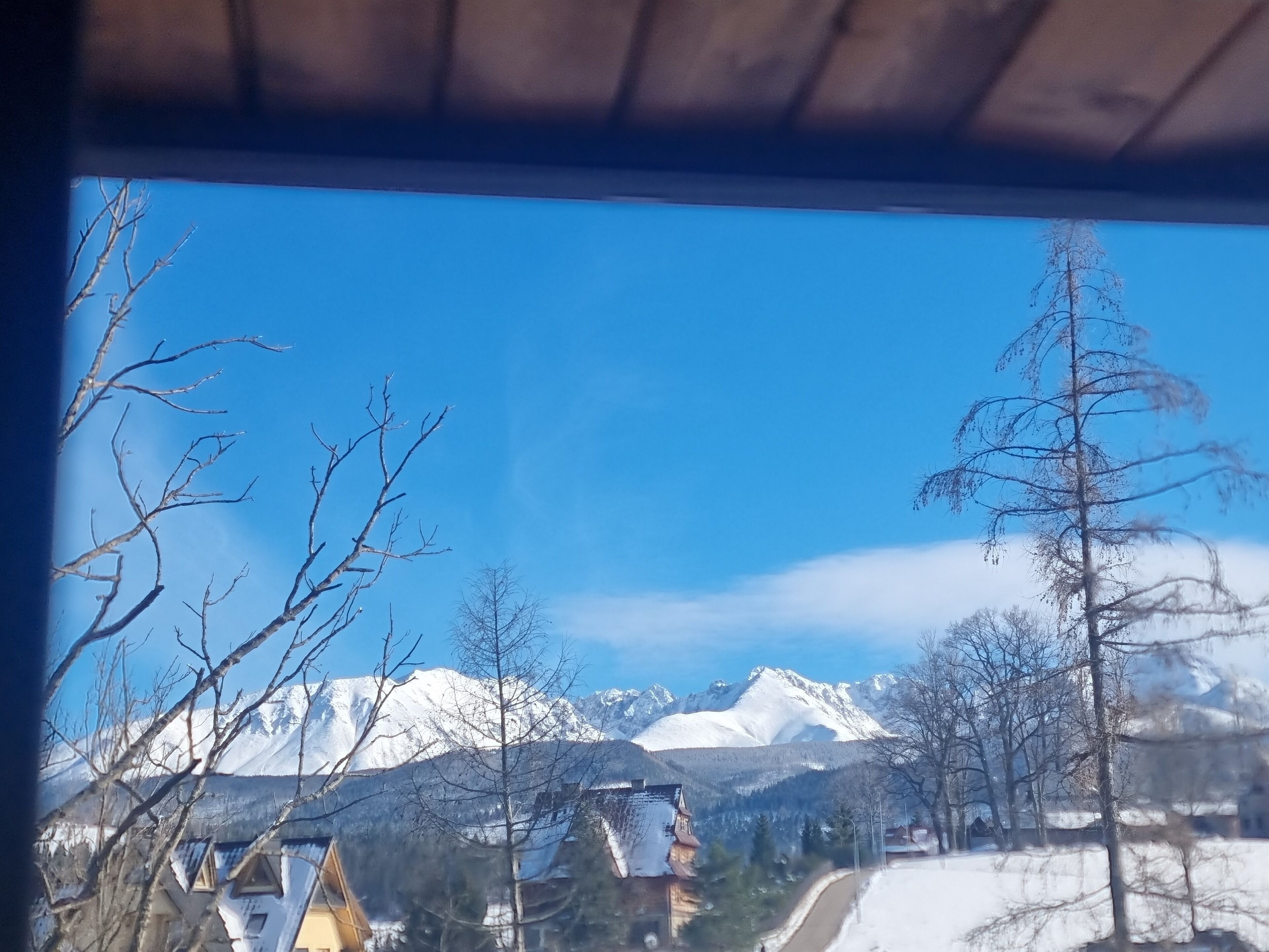 A snowy mountain landscape with a clear sky.