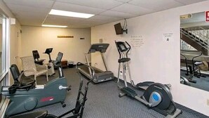 A fitness room with treadmills, elliptical machines, and a stationary bike. - Lovely 2 bedroom condo with nice amenities and on the bus line (Rochester)