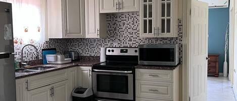 Microwave, oven, electric kettle, dining tables