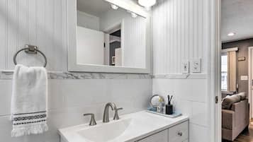 Combined shower/tub, hair dryer, towels, soap