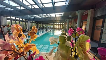2 indoor pools, seasonal outdoor pool, pool umbrellas, pool loungers