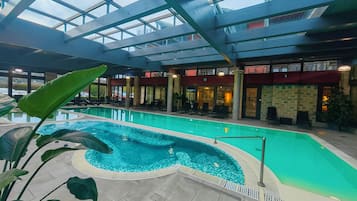 2 indoor pools, seasonal outdoor pool, pool umbrellas, pool loungers
