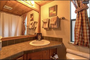 Combined shower/bathtub, towels, soap, shampoo