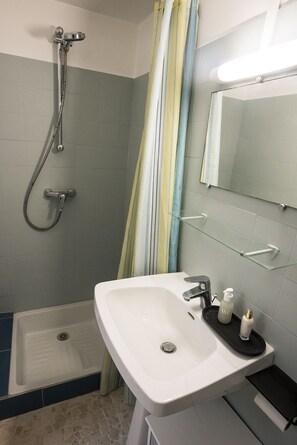Shower, hair dryer, soap, shampoo