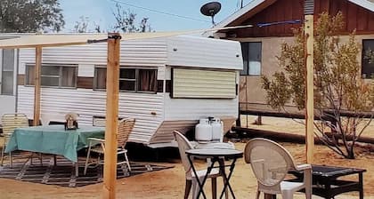 Retro trailer in fun desert setting with private fire pit