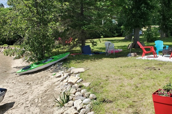 Beach and Kayak and Motor boat on site for rental .
