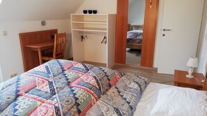 A bedroom with a bed, a desk, a wardrobe, and a mirror. - Spacious quiet farmhouse between Lys and Scheldt, Belgium (Anzegem)