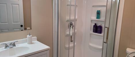 Shower, hair dryer, towels, soap