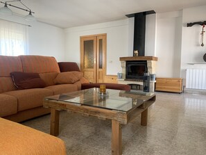 Smart TV, fireplace, table football, books