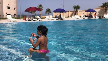 Seasonal outdoor pool, free pool cabanas, pool umbrellas
