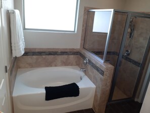 Combined shower/bathtub, hair dryer, towels, soap