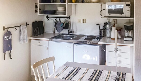 Fridge, stovetop, coffee/tea maker, cookware/dishes/utensils