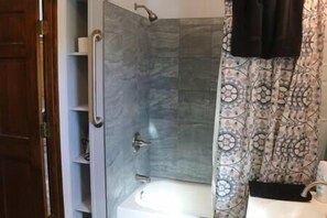 Combined shower/tub, hair dryer, towels, soap