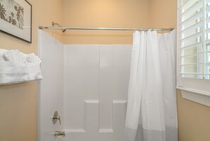 Combined shower/tub, hair dryer, towels, soap